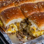 baked egg sausage sliders with one missing