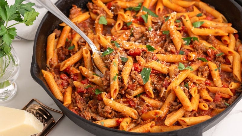 one pot sausage pasta with a spoon