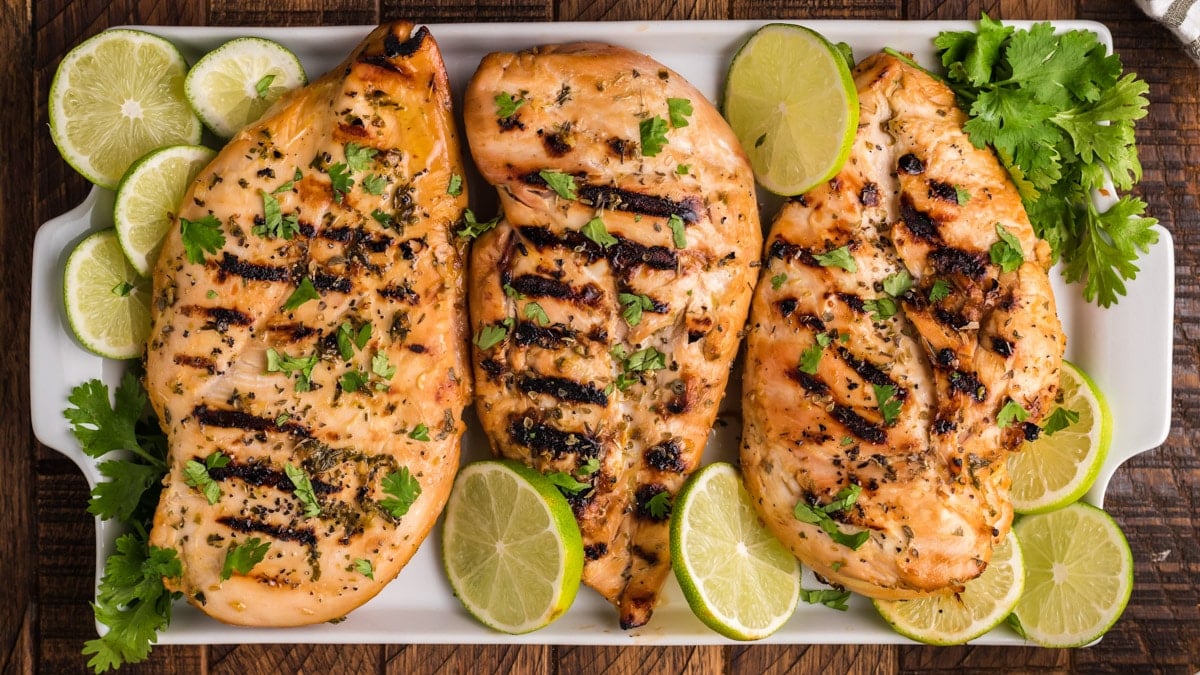 3 grilled key west chicken breasts on a platter