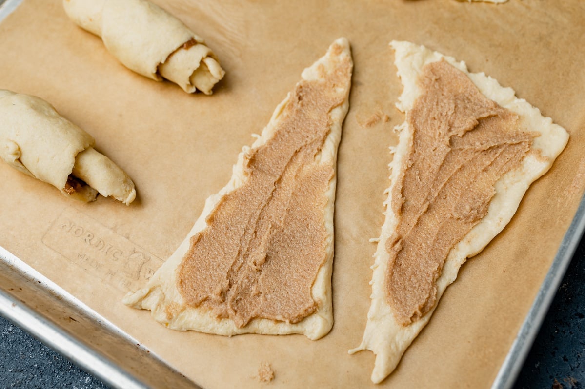 cinnamon filling brushed on crescent rolls