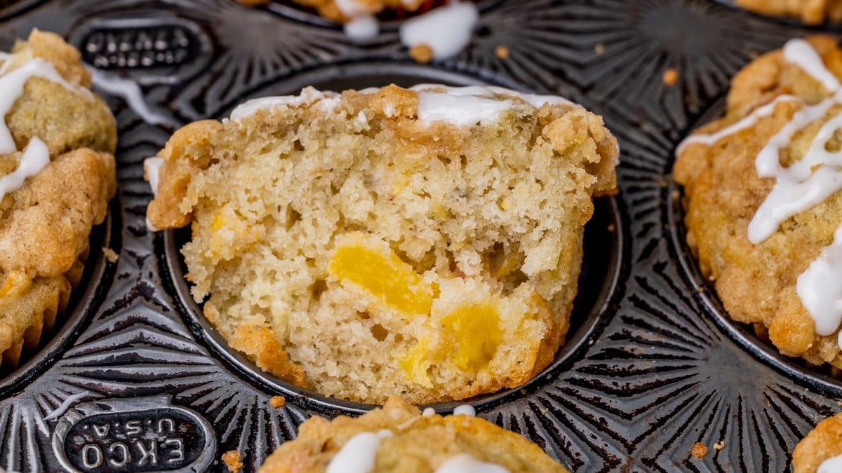 half of a peach crumble muffins