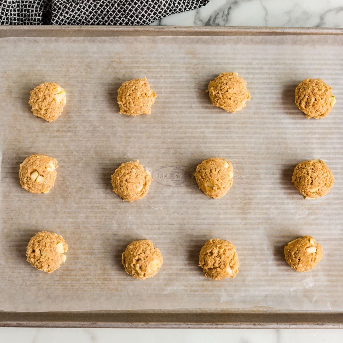 unbaked apple oatmeal cookies on a pan