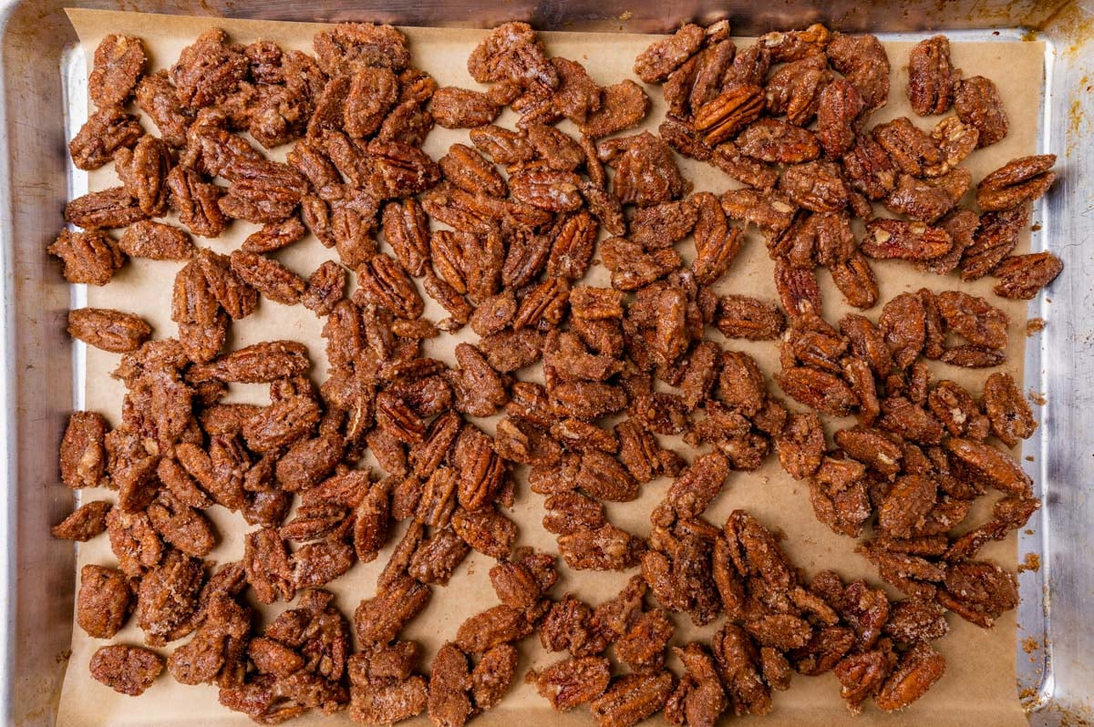 unbaked cinnamon sugar pecans on a baking sheet