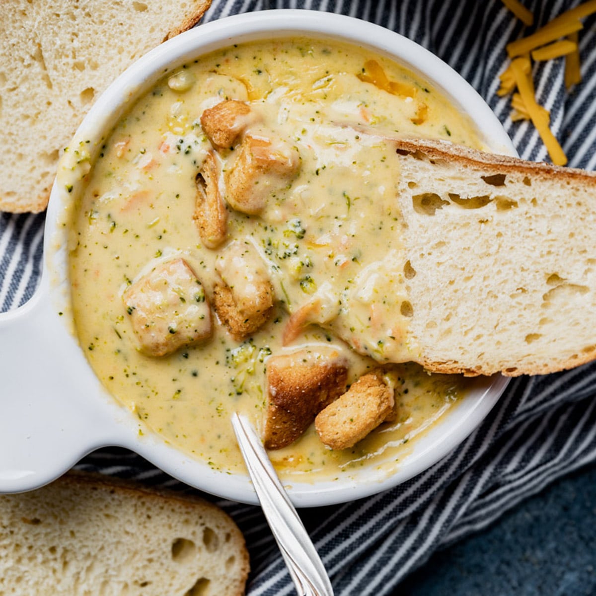 overhead view of a bowl of broccoli cheddar soup
