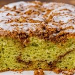 half of a loaf of pistachio bread on a table