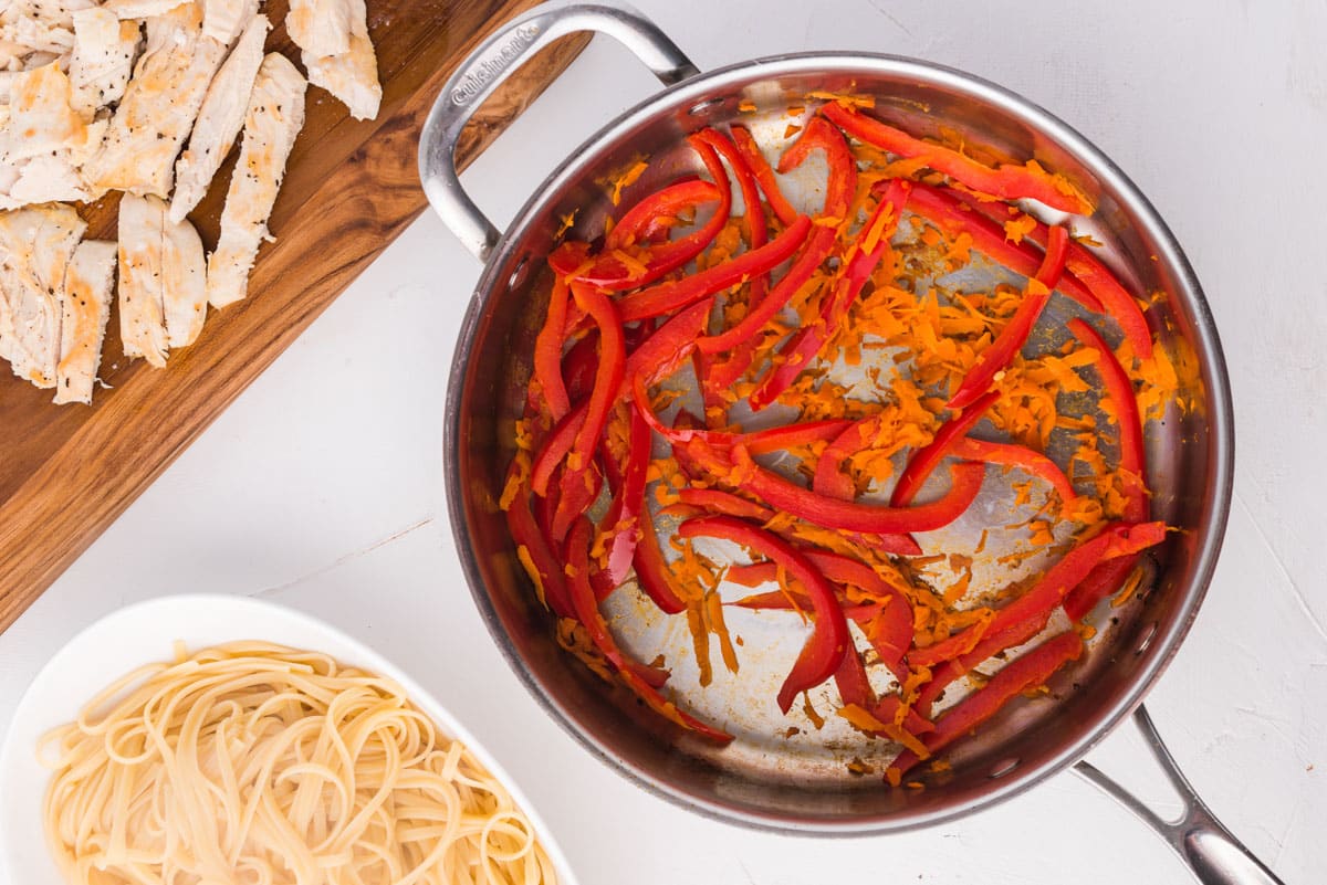 carrots and red peppers in a skillet