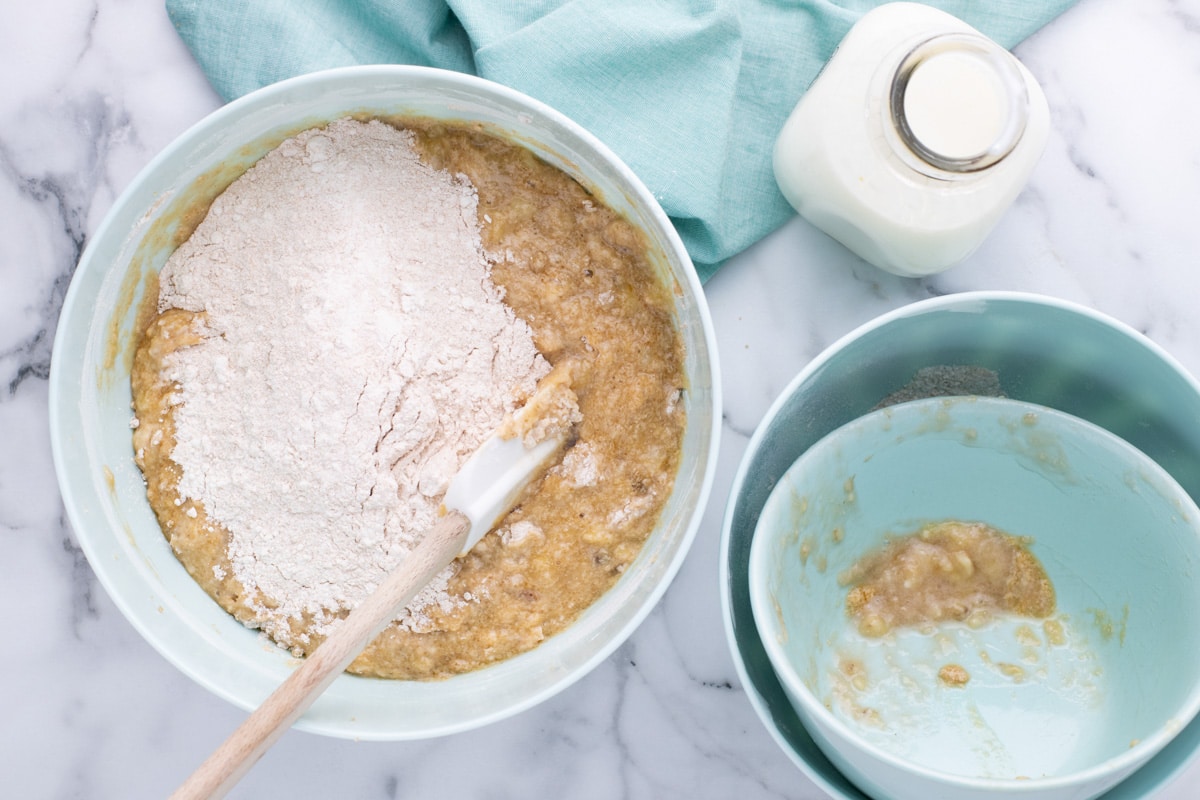 wet ingredients with dry ingredients over top in a bowl