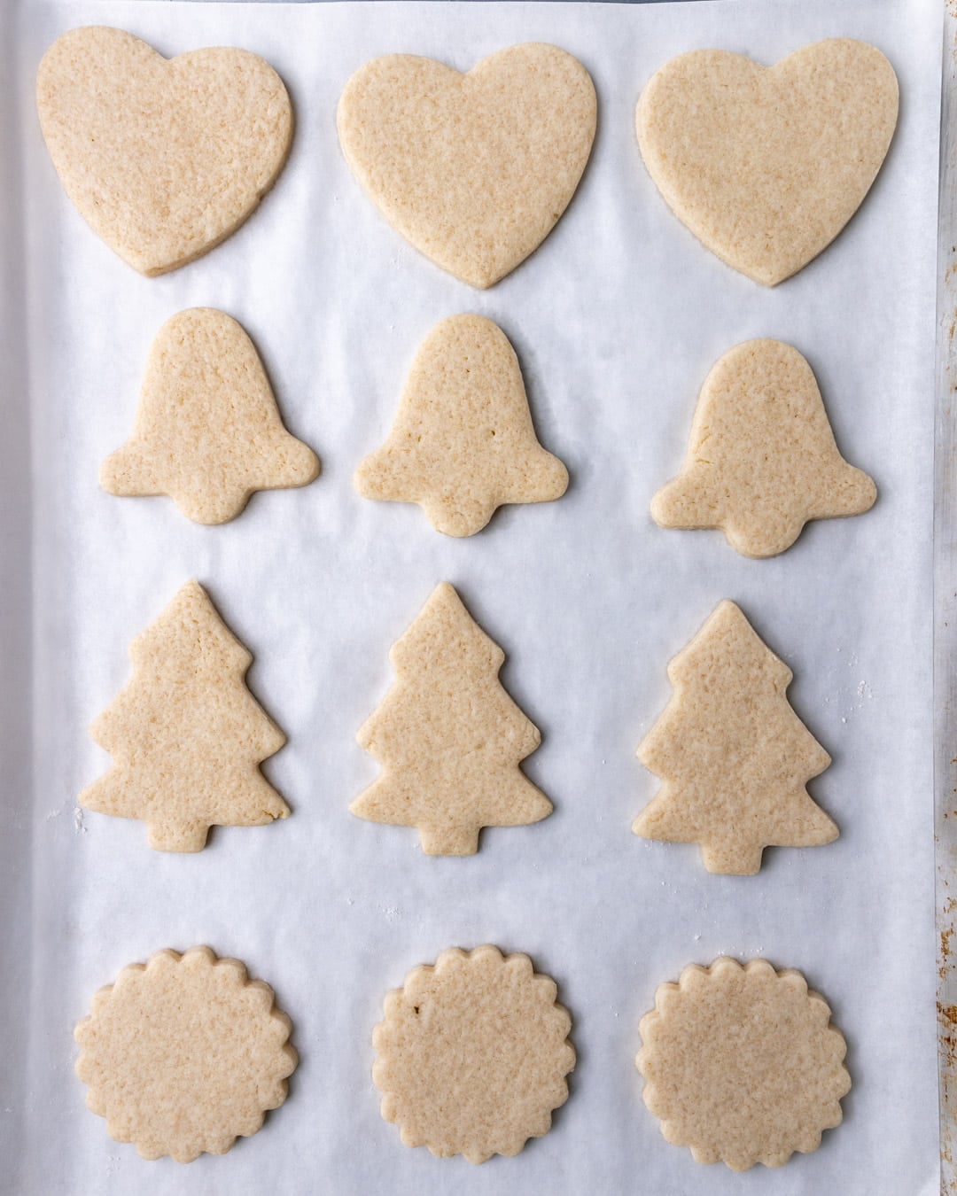cream cheese cut out cookies baked on a pan