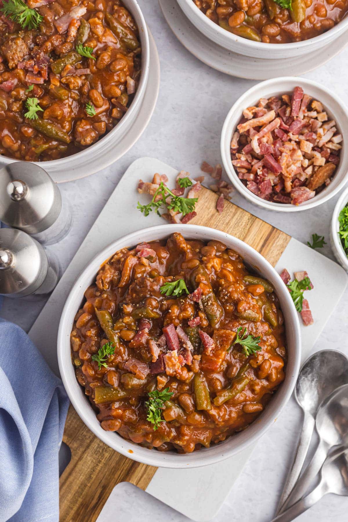 overhead views of bowls of sausage and bean casserole