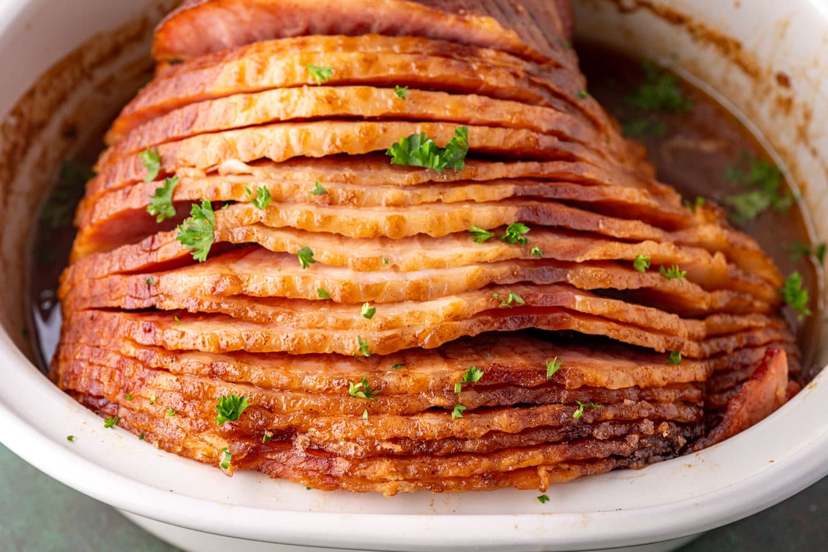 closeup of glazed crockpot ham in a pot