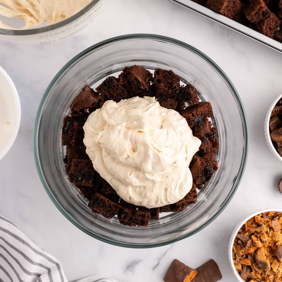 peanut butter cream layered over cake in a trifle dish