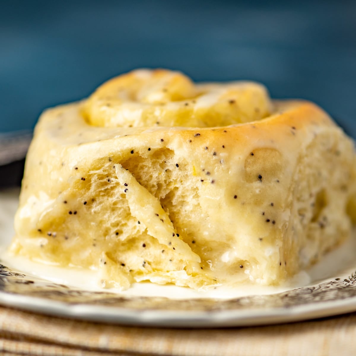 a lemon poppy seed roll on a plate