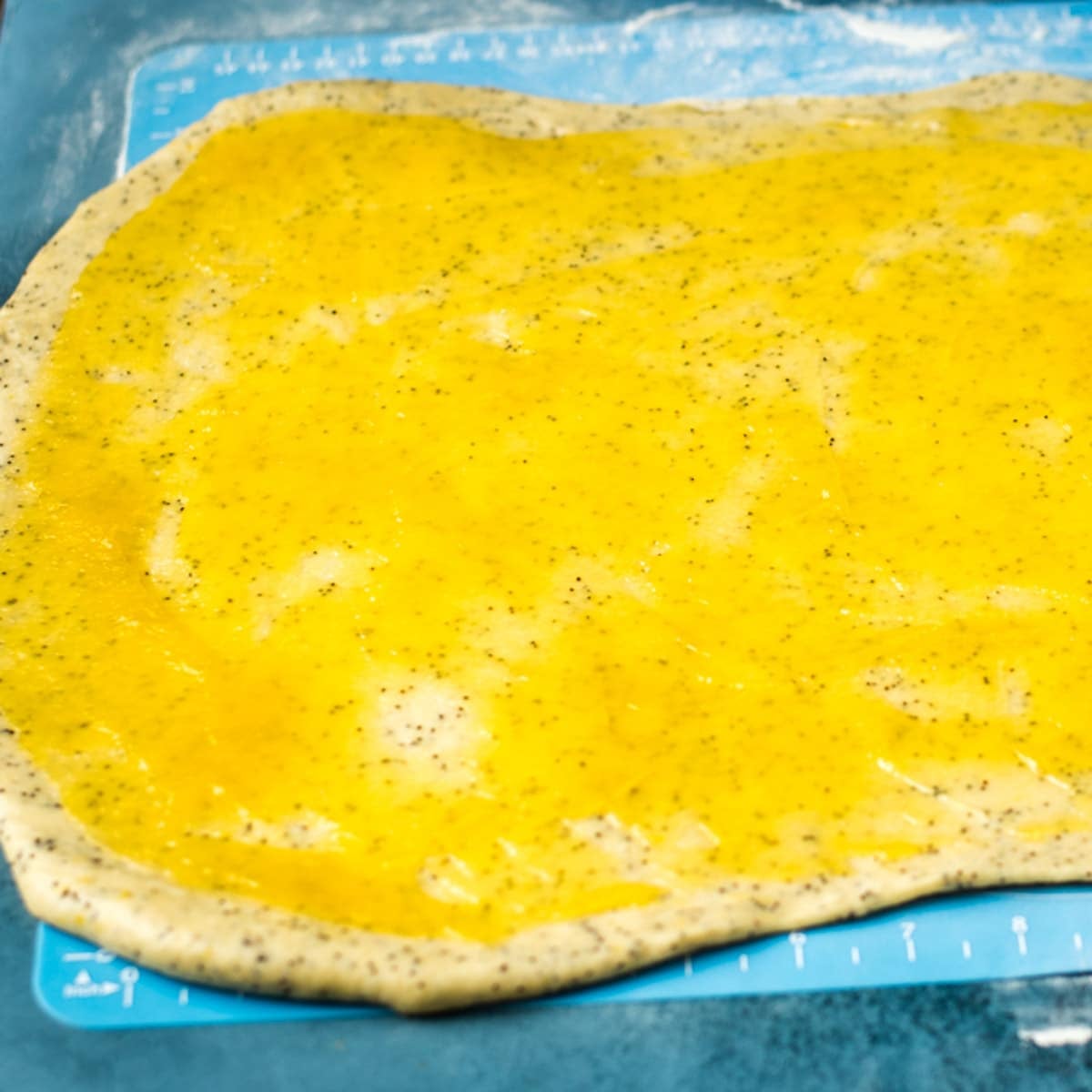 lemon curd over lemon poppy seed dough