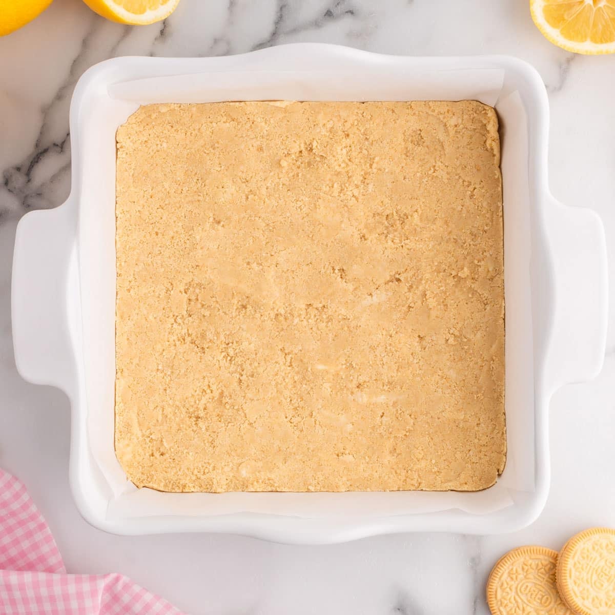 golden oreo crust pressed into an 8x8" baking pan