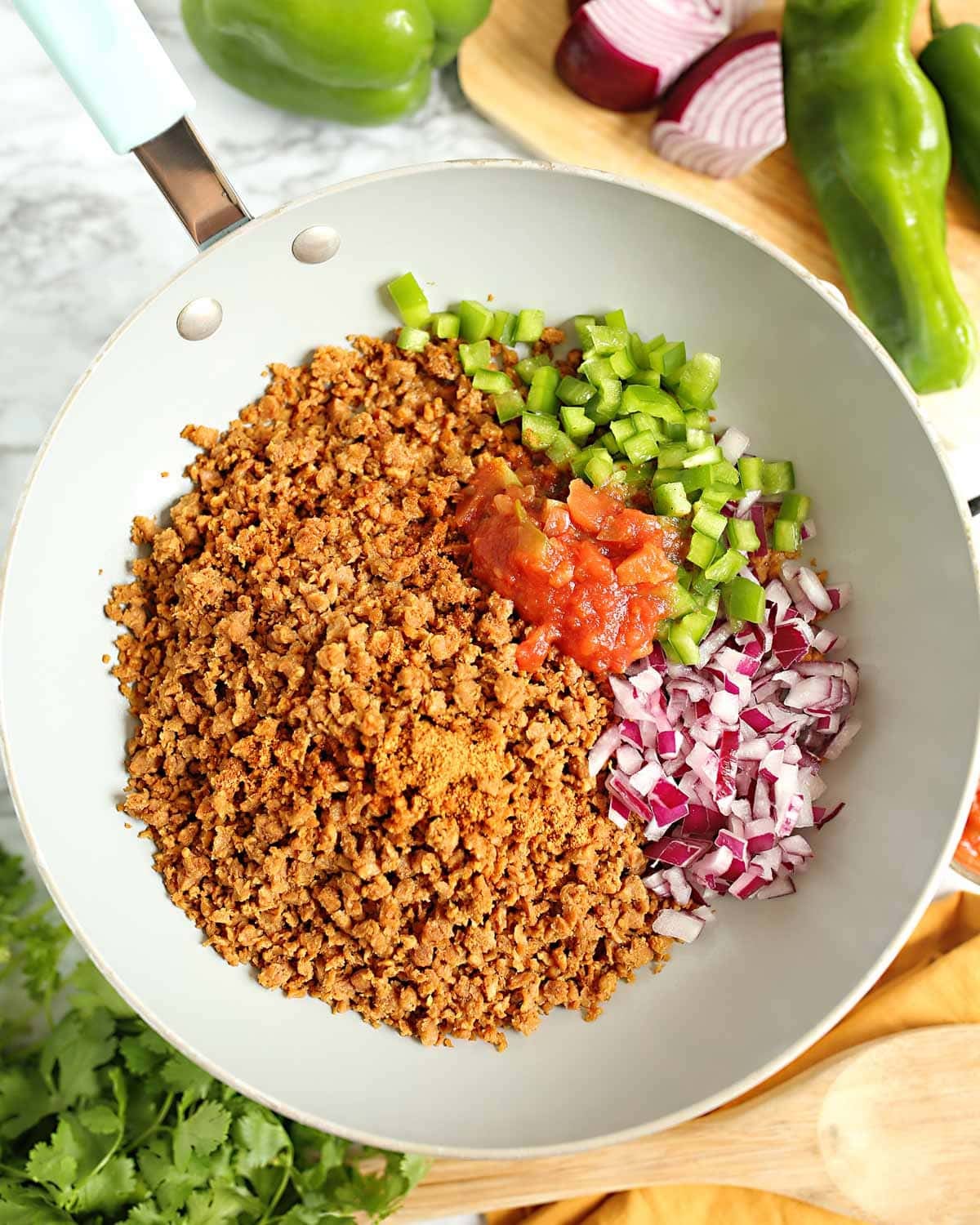 taco meat, peppers, onions and salsa in a skillet