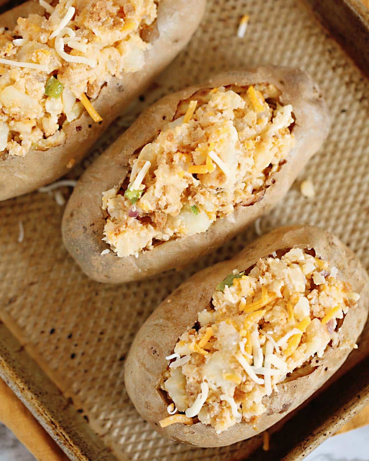 unbaked twice baked potatoes on a baking sheet