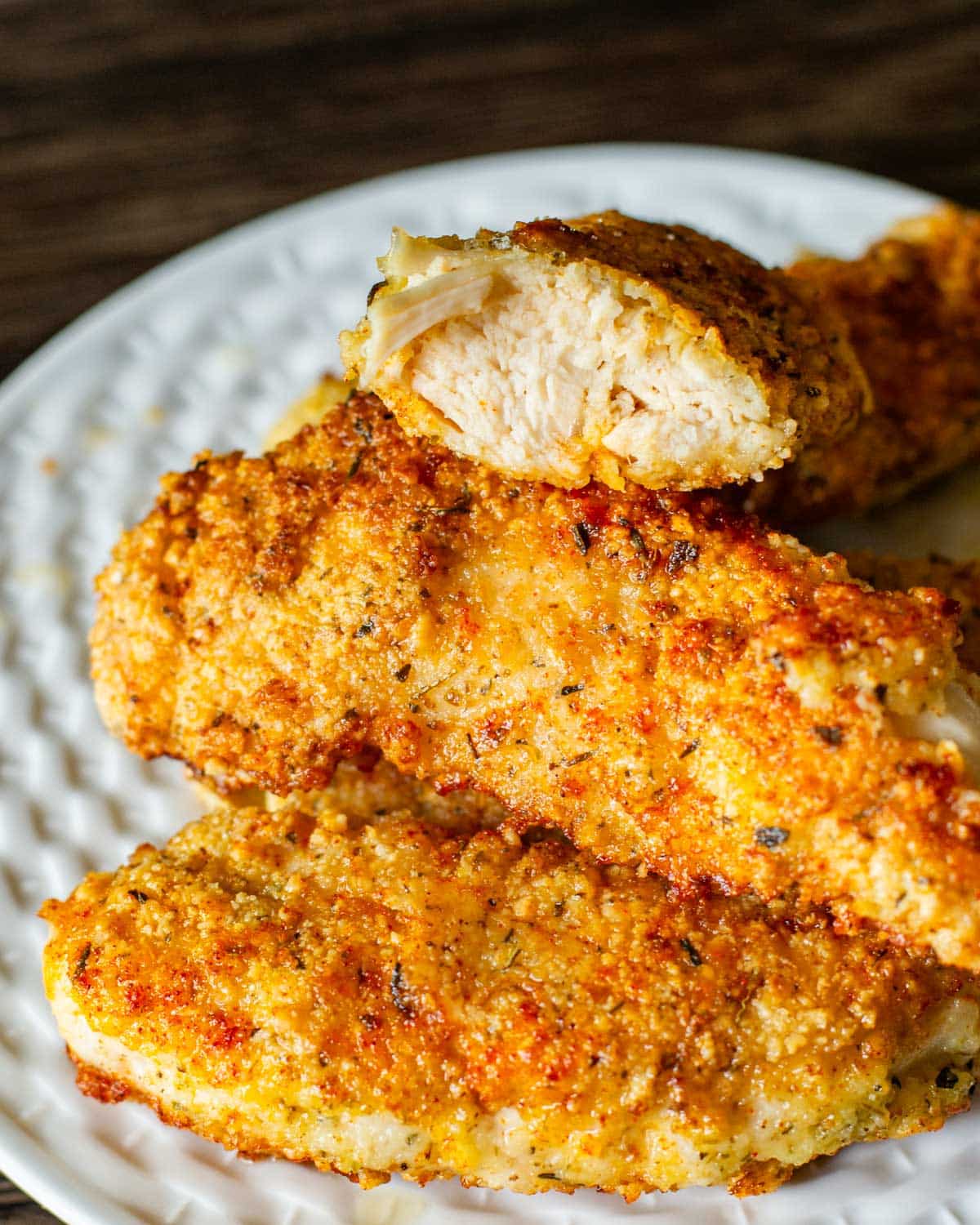 a pile of golden brown paleo chicken strips