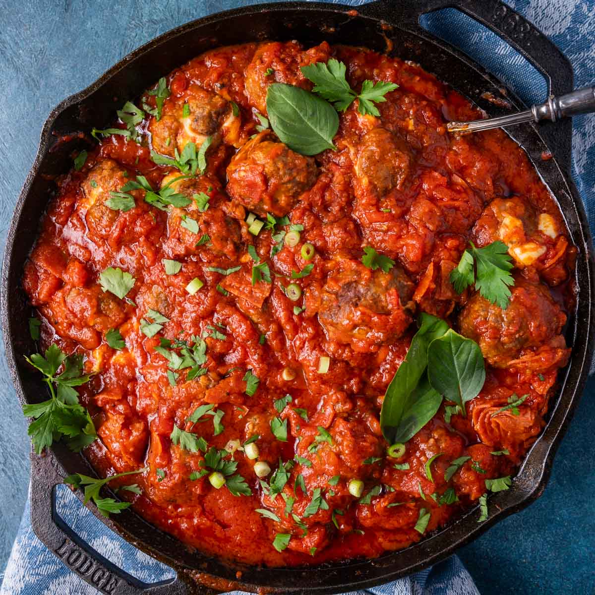 overhead view of pizza meatballs in a skillet