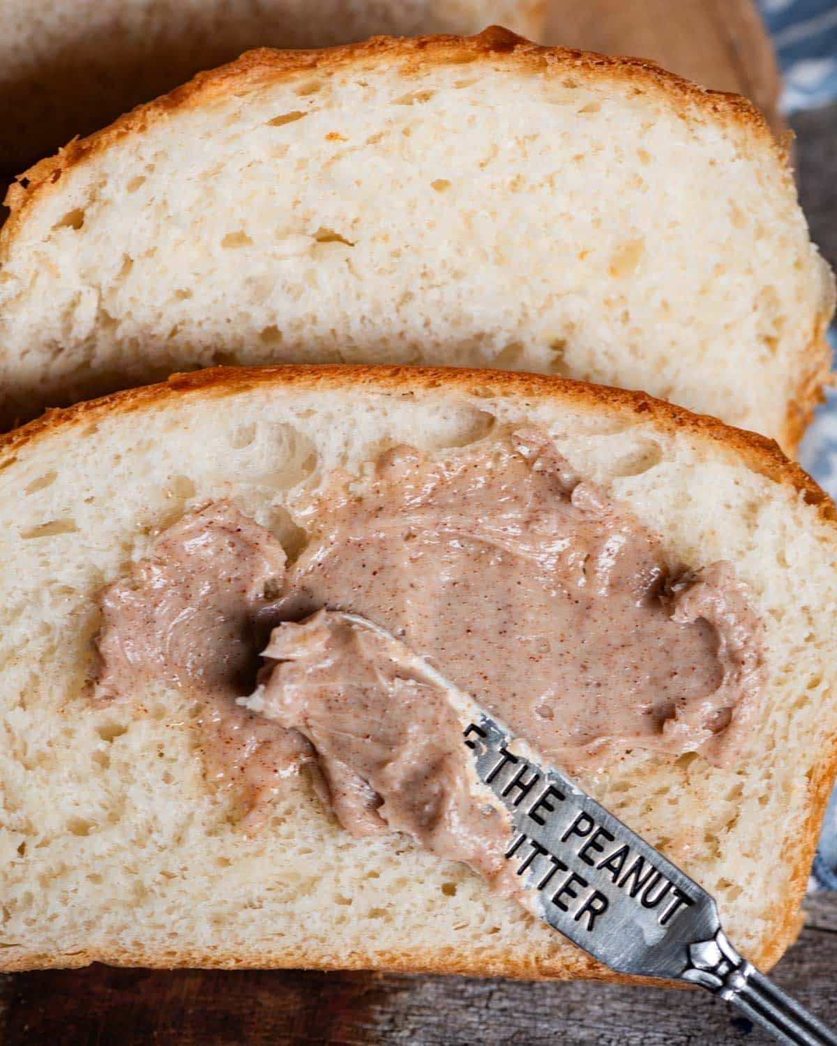 spreading cinnamon butter on potato bread