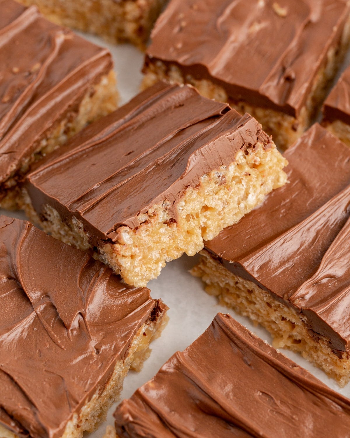 a pile of rice krispies scotcheroo bars on a table