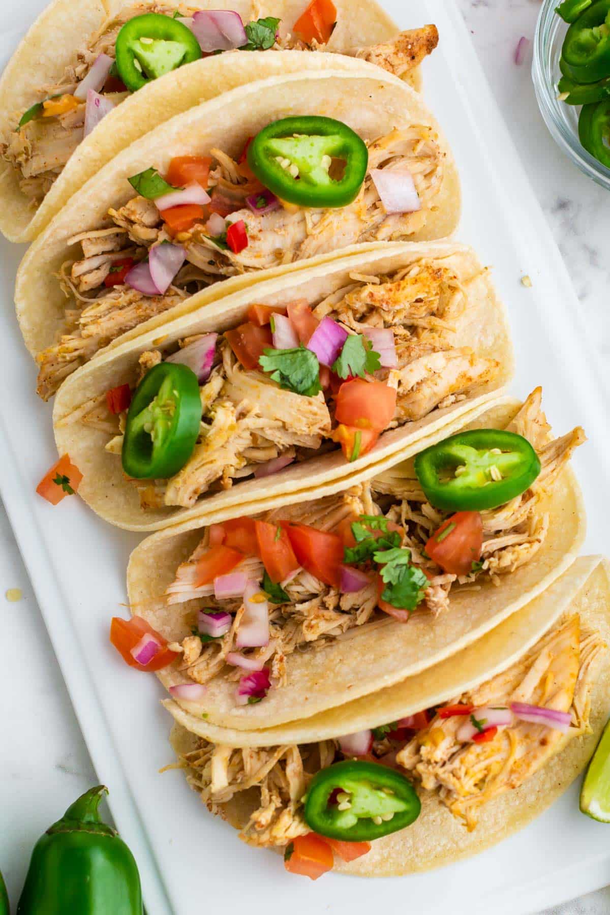 overhead view of 5 salsa verde tacos