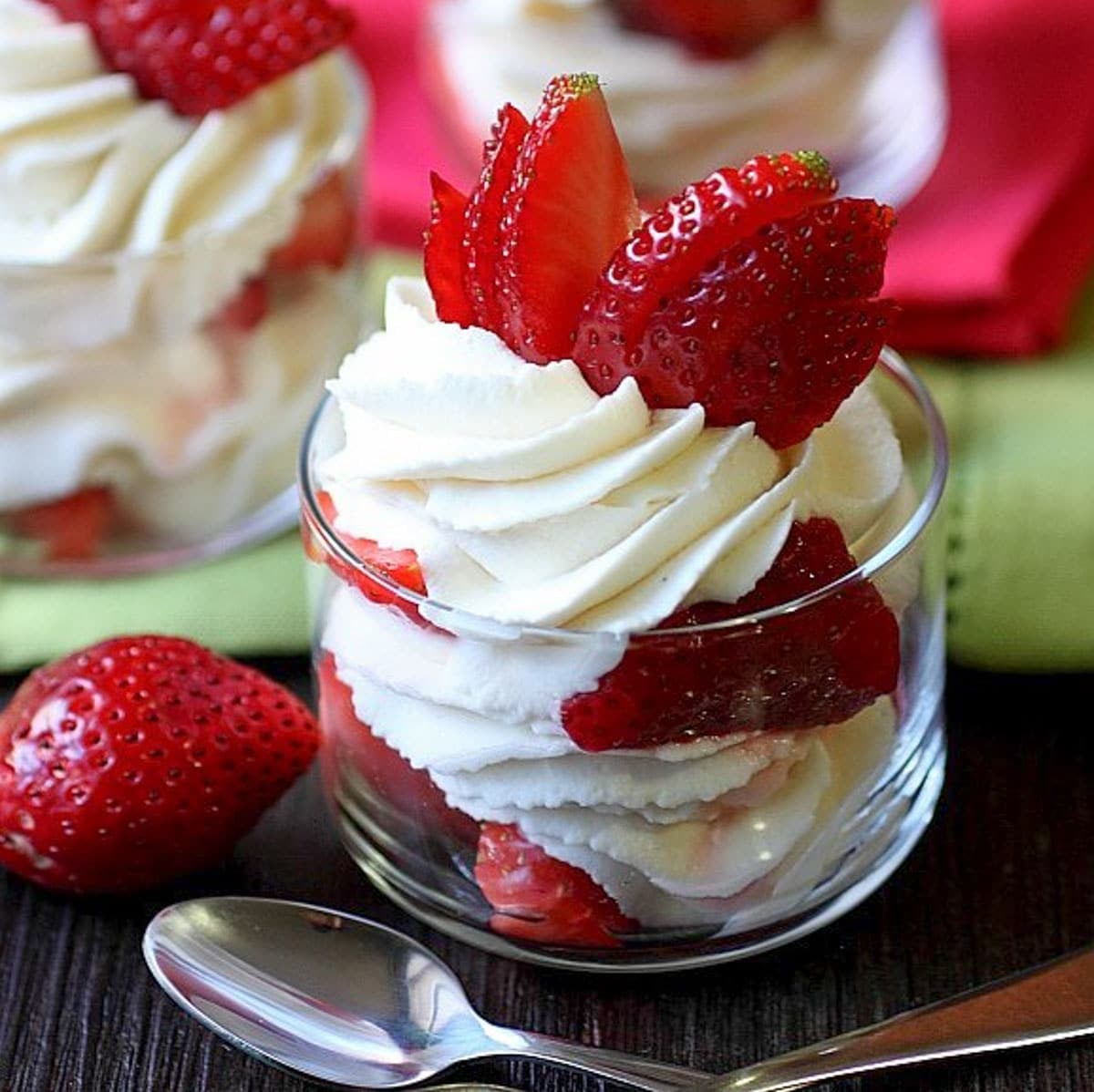 strawberries and whipped cream in a glass