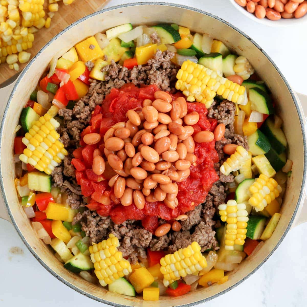 ingredients for summer chili in a dutch oven