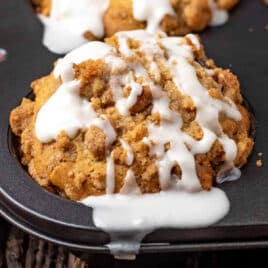 an apple butter muffin in a muffin pan