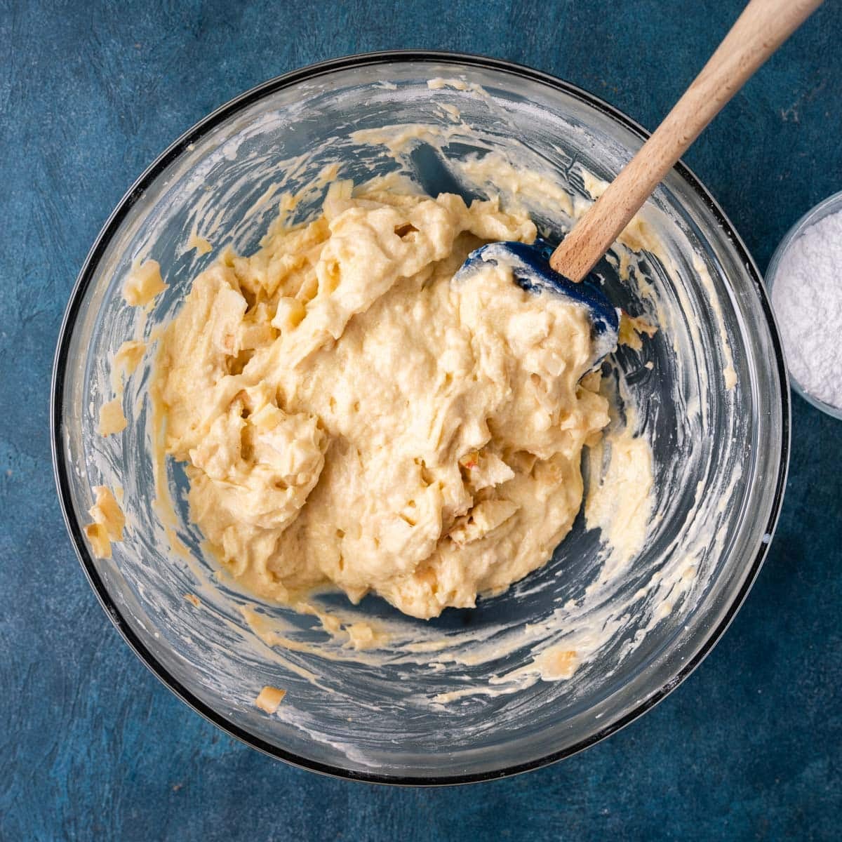 quick bread batter with apples in a bowl