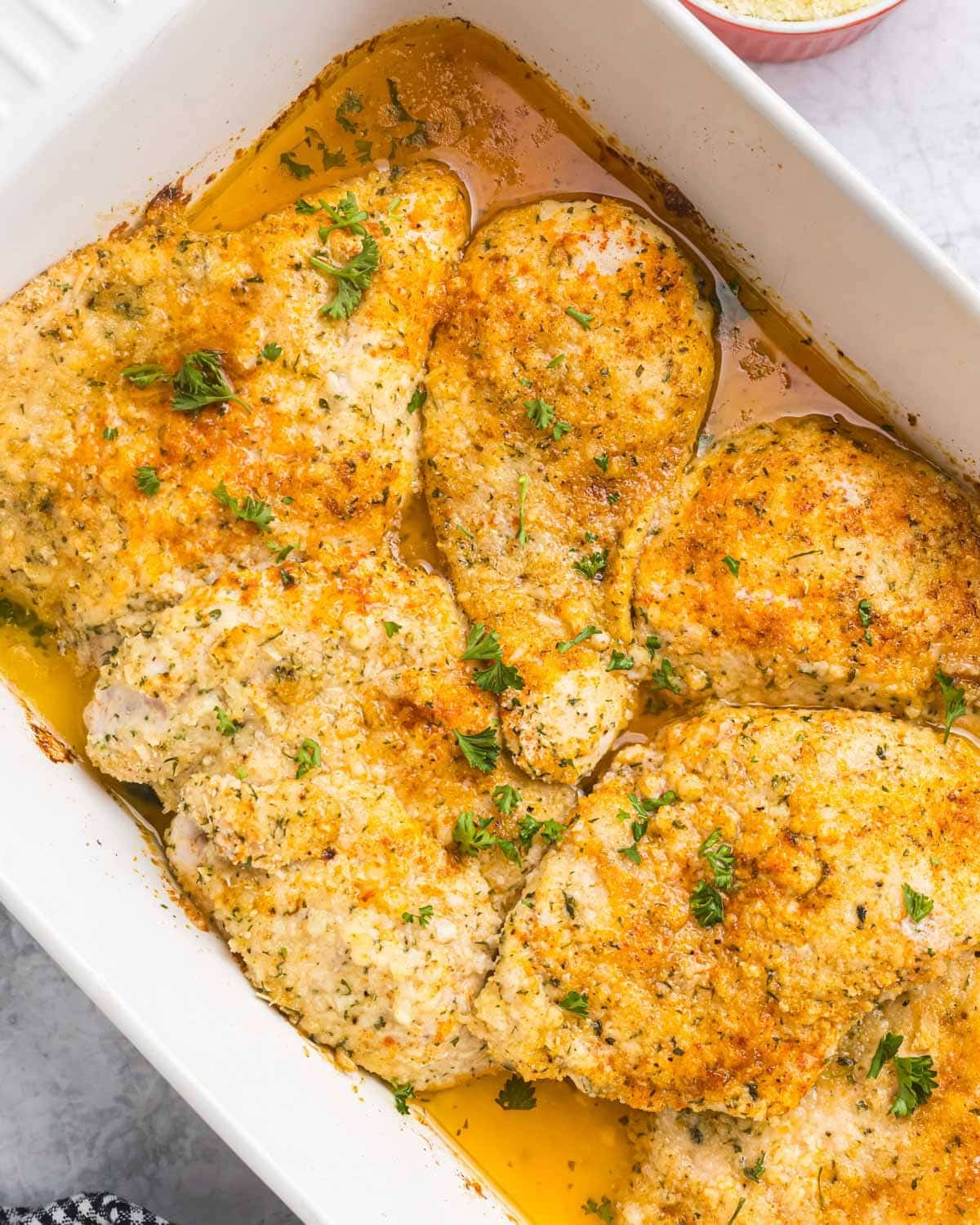 overhead shot of garlic butter parmesan chicken in a casserole