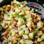 closeup of breakfast potatoes o'brien in a skillet