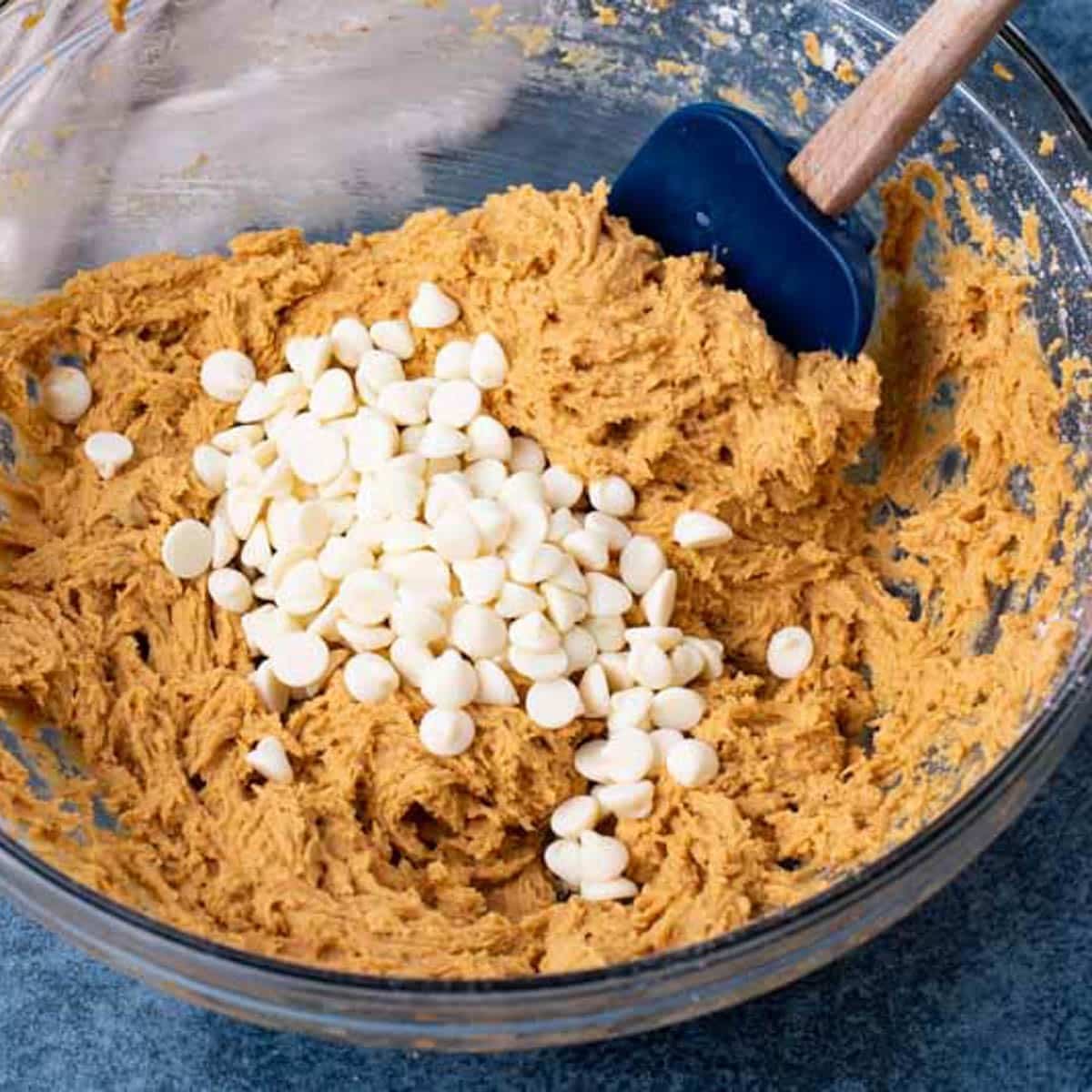 pumpkin cookie dough with white chocolate chips on top