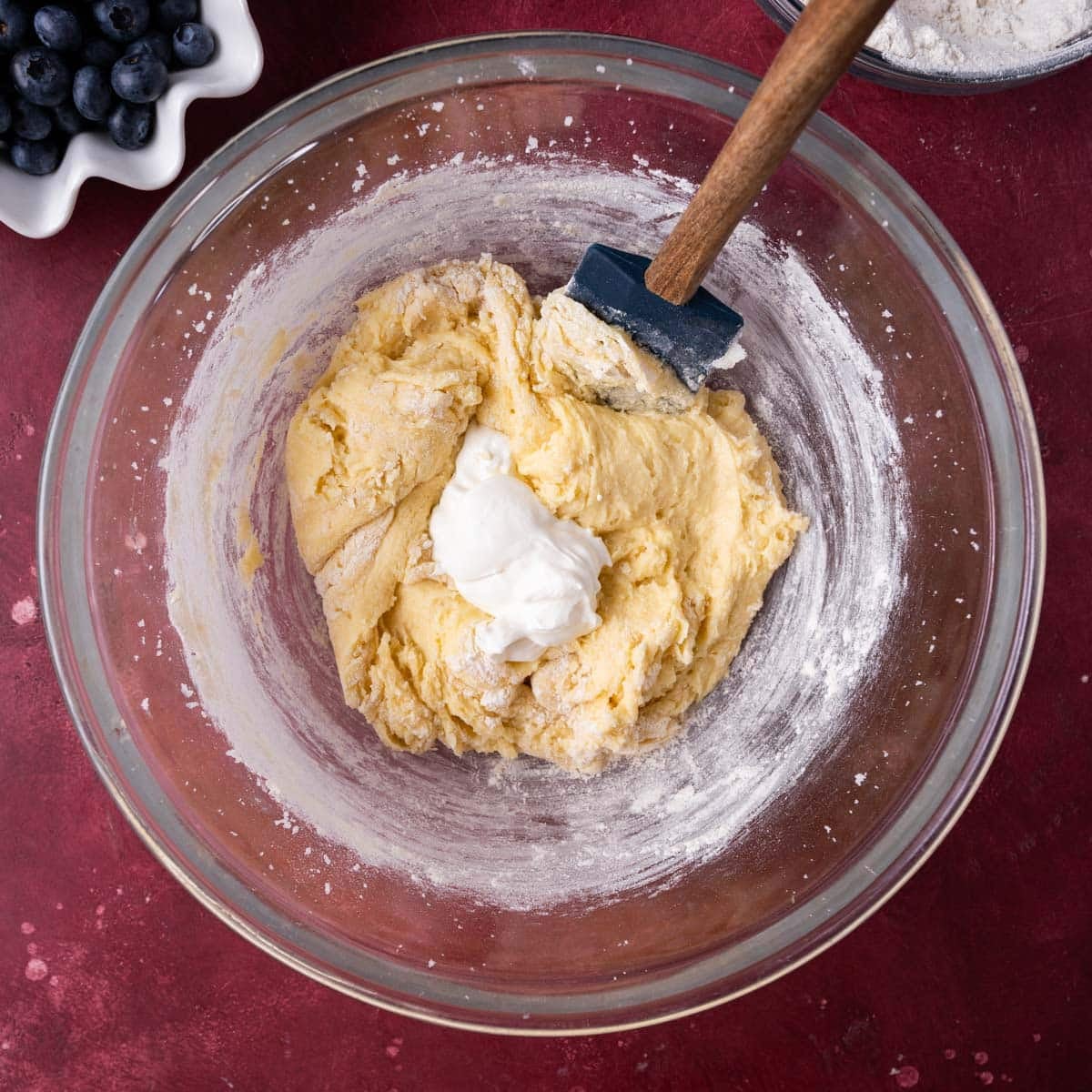 cake batter with a dollop of sour cream on top