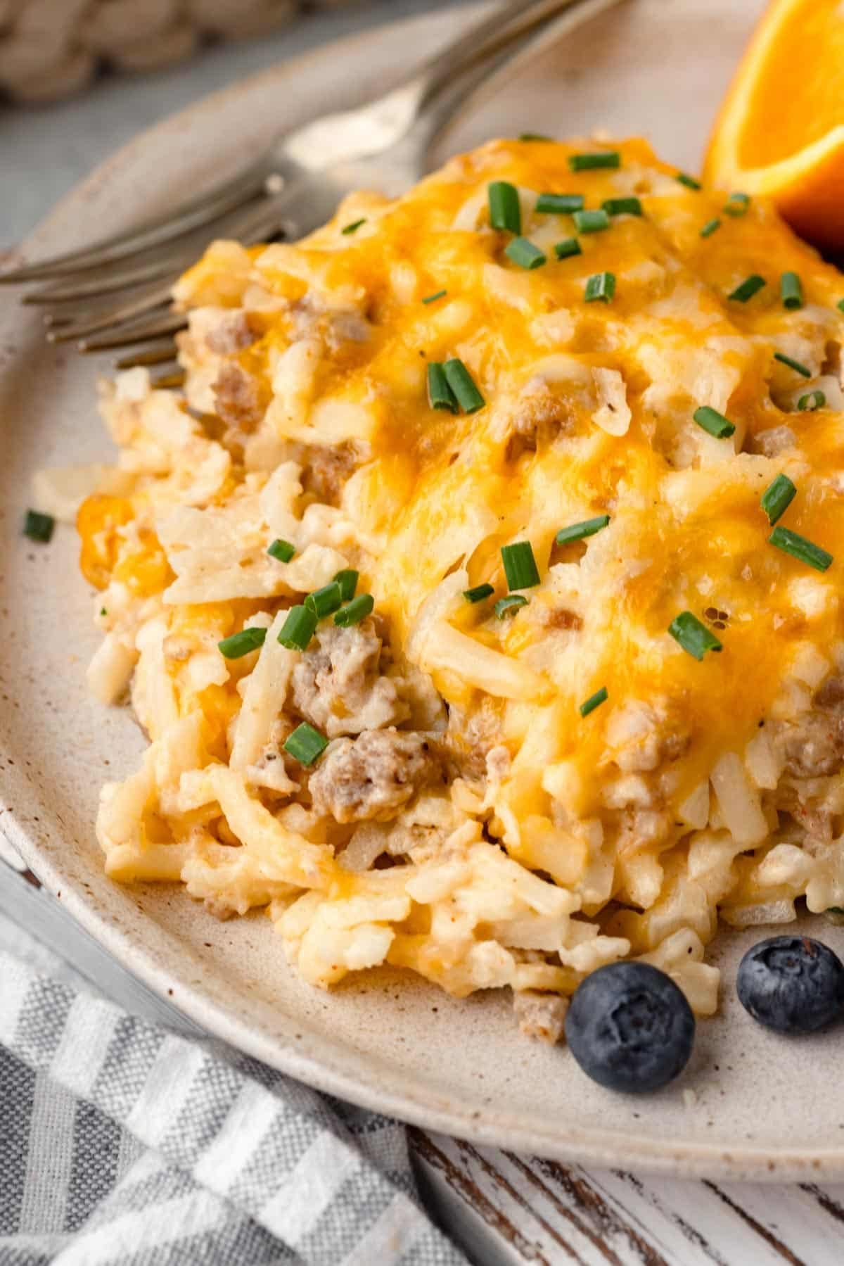 a piece of sausage hash brown casserole on a plate
