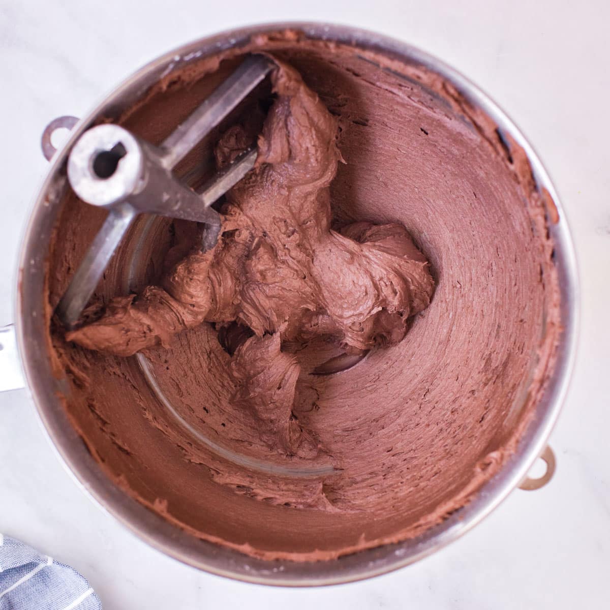 chocolate frosting in a mixing bowl