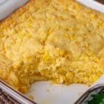 easy corn casserole in a baking dish with one scoop out