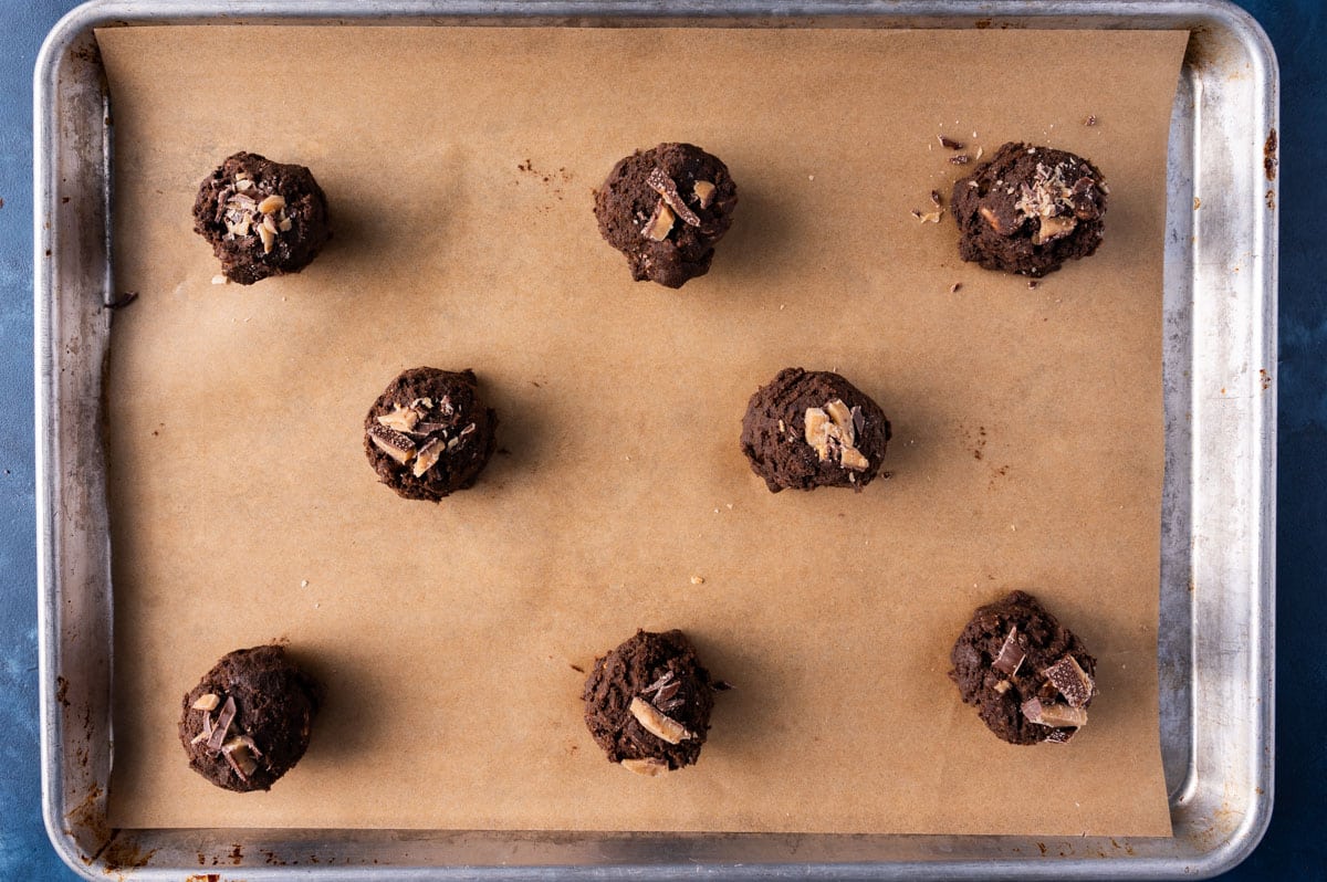 unbaked cookies with toffee bits on top