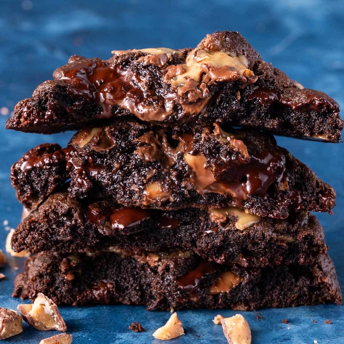 a stack of 4 levain style coffee toffee cookies cut in half