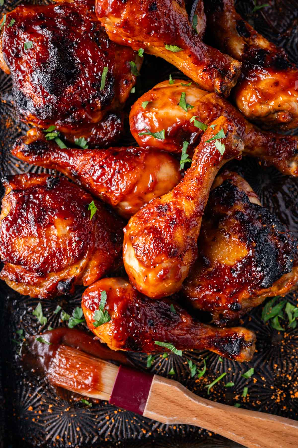 overhead view of barbecue chicken on a baking sheet