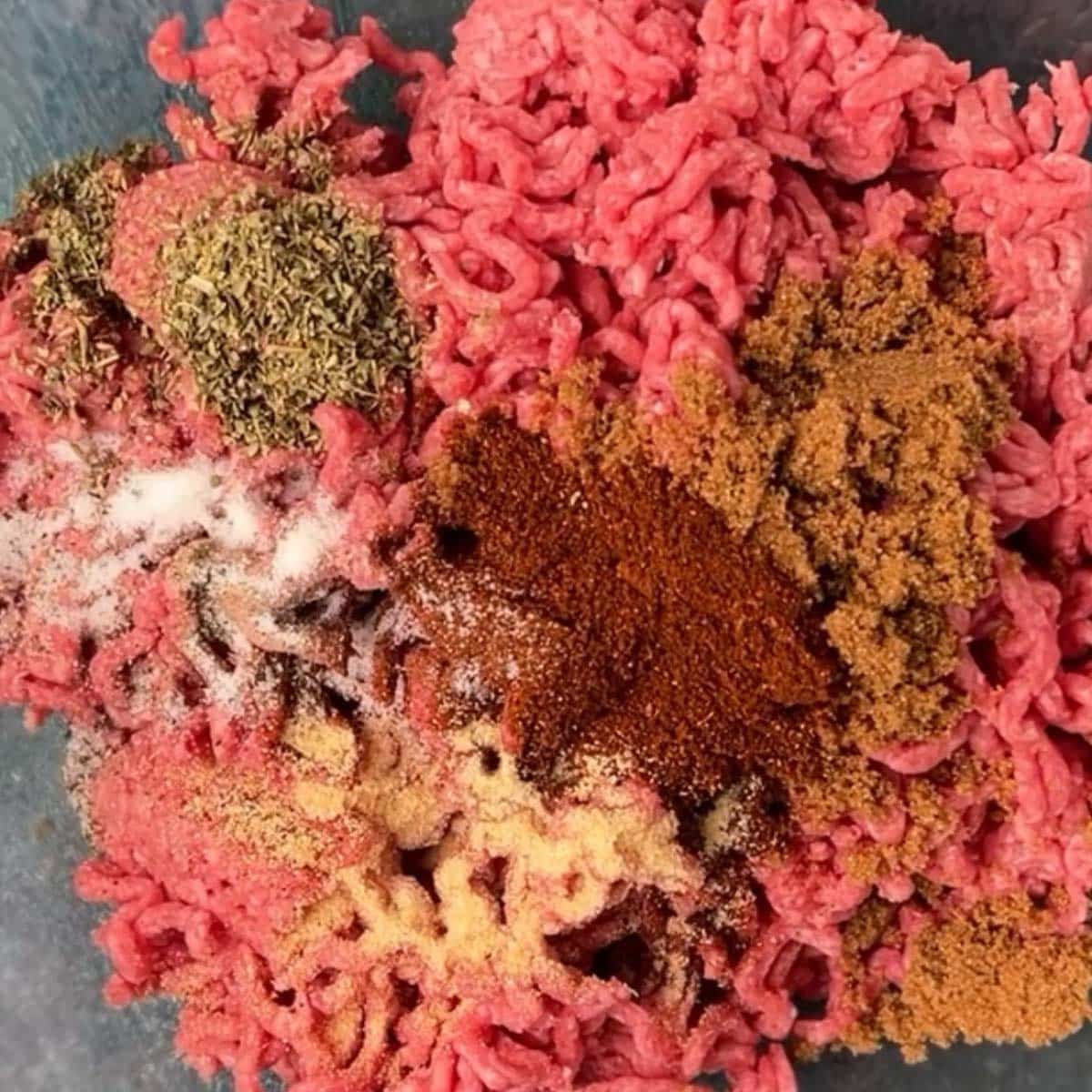 ground beef with seasonings on top