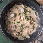 chicken stroganoff in a pan with a spoon