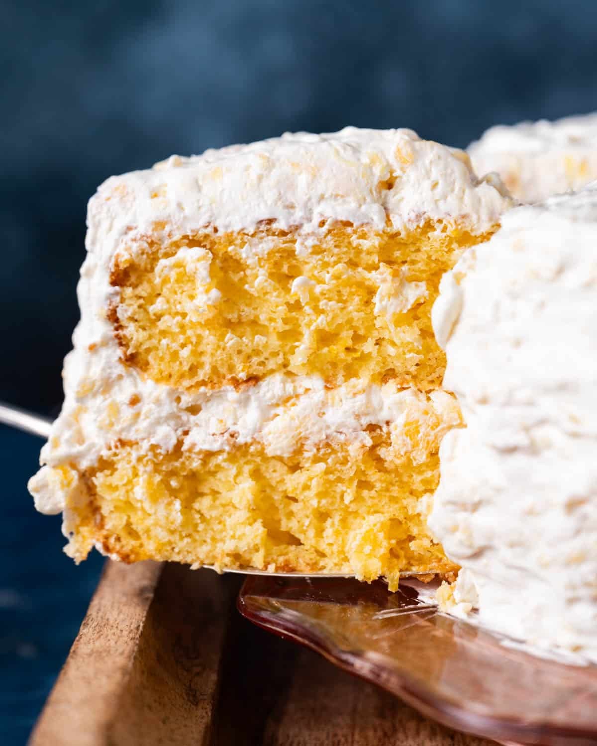 a slice of pig pickin' cake on a spatula