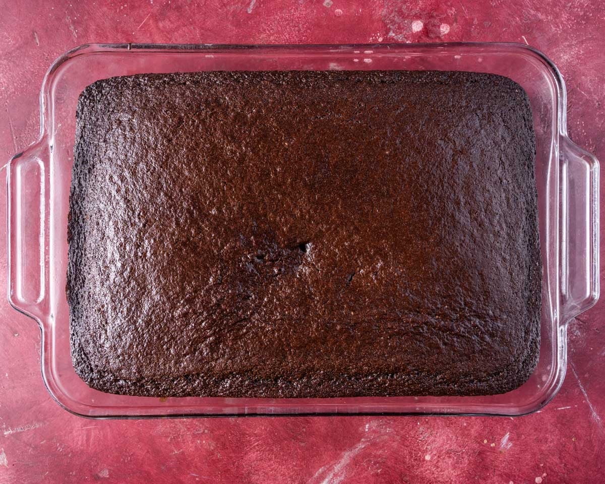 baked chocolate cake in a 9x13" glass pan