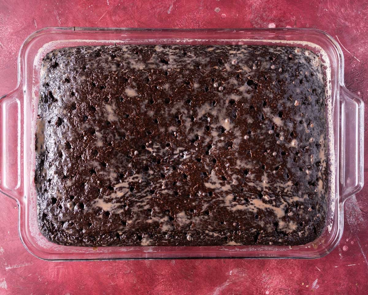 a chocolate cake with milk poured over it