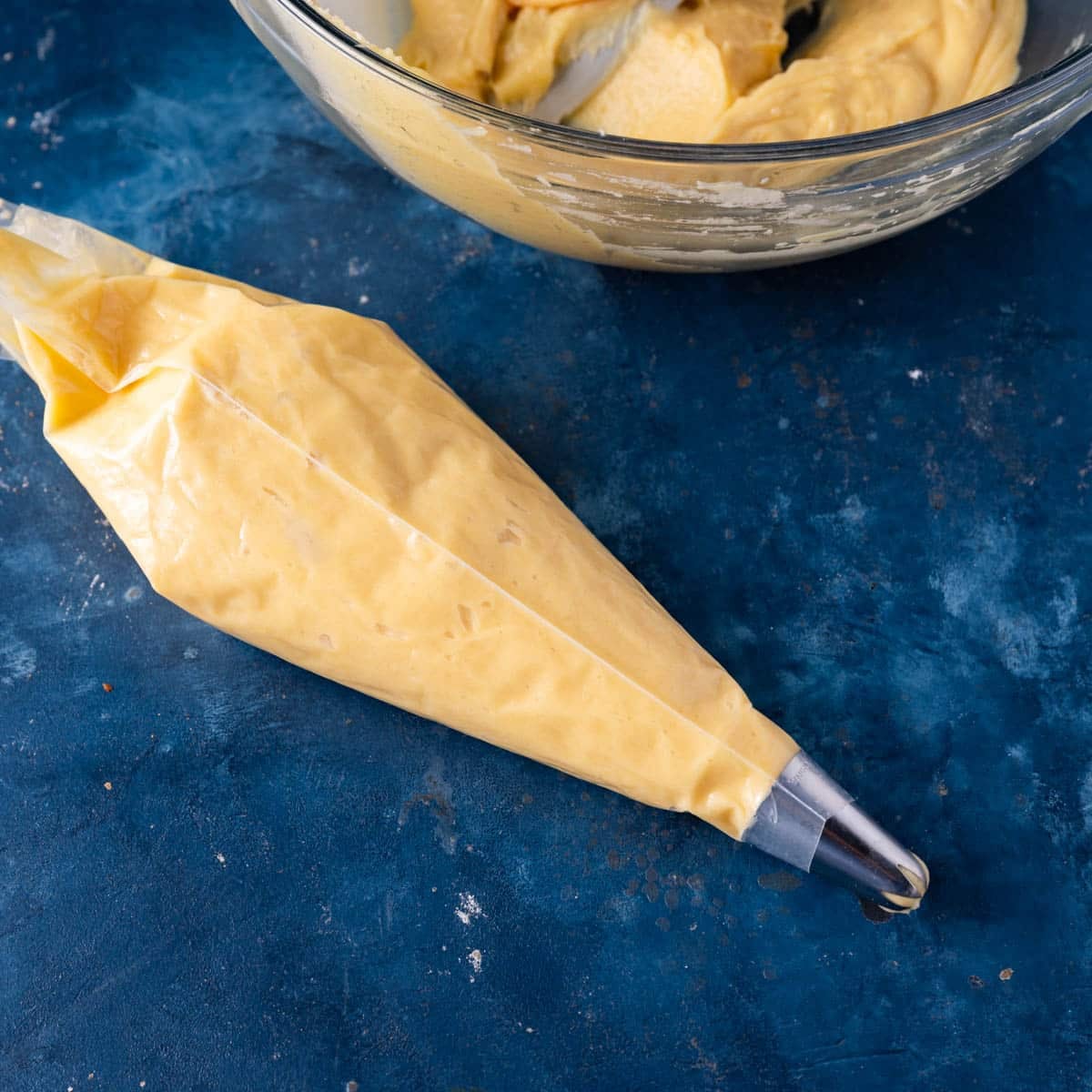 donut batter in a bag with a piping tip