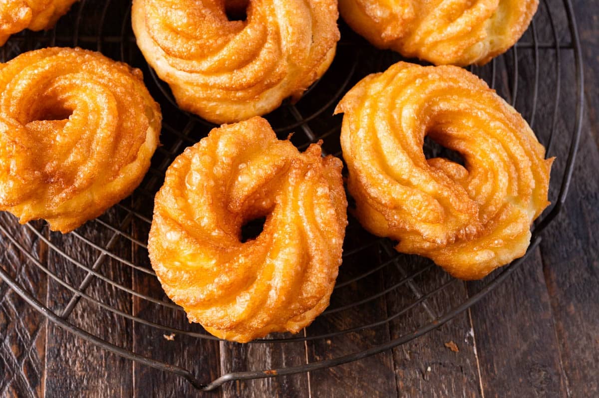 fried crullers on a wire rack