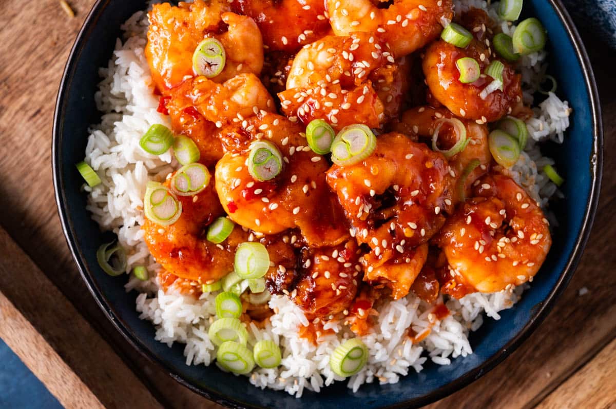 firecracker shrimp on a plate with rice
