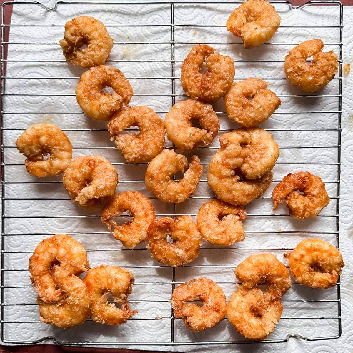 fried shrimp on a wire rack