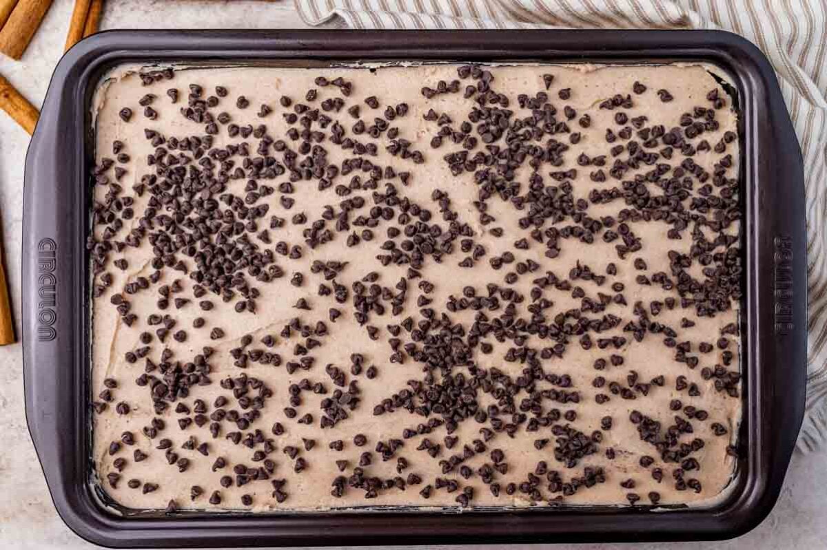 overhead view of a chocolate frosted cake in a baking pan