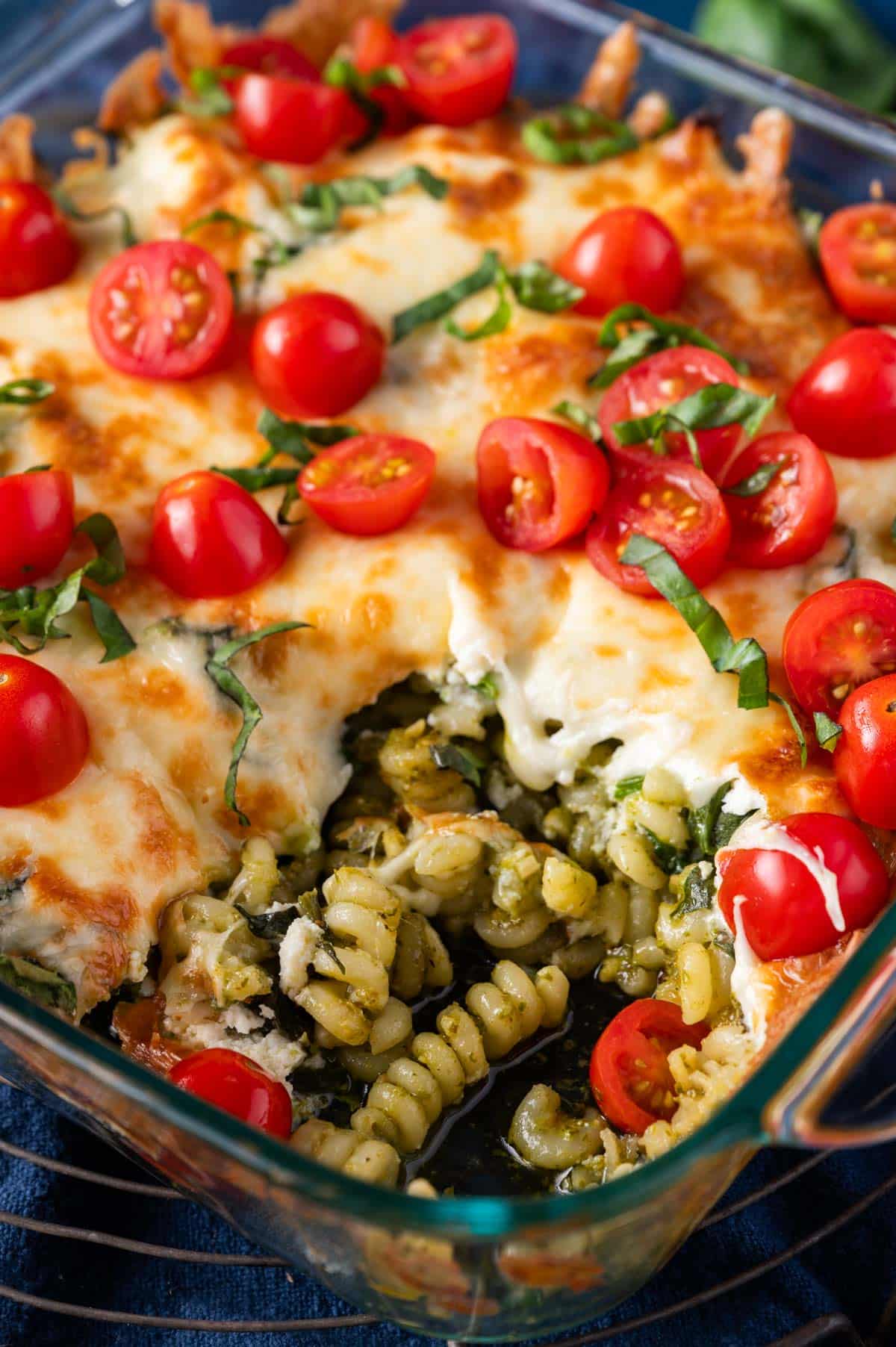 pesto pasta bake with one serving out
